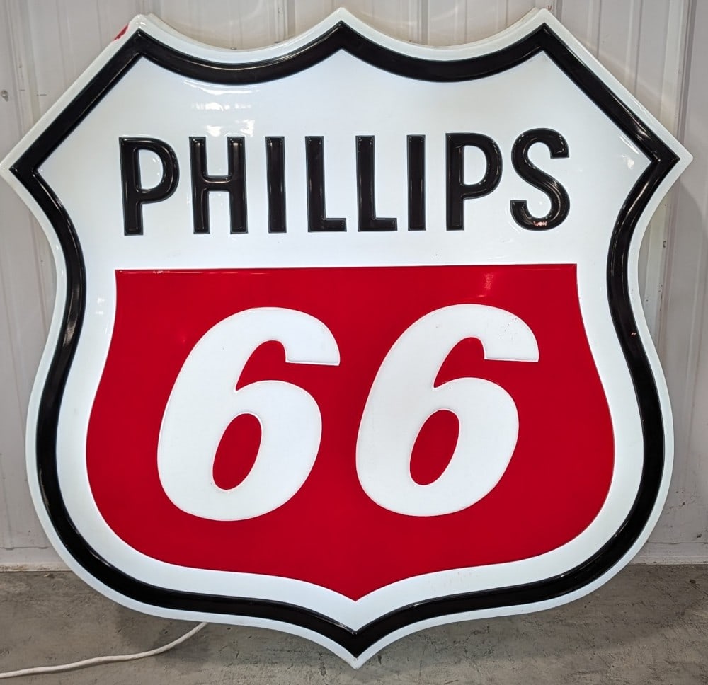 Large Phillips 66 Gas Station Lighted Shield Advertising Sign: Large single sided embossed plastic Phillips 66 Gas station lighted advertising sign. Appears to be in good working condition with some paint loss, scratches / scuffs, and other wear from use. It is m