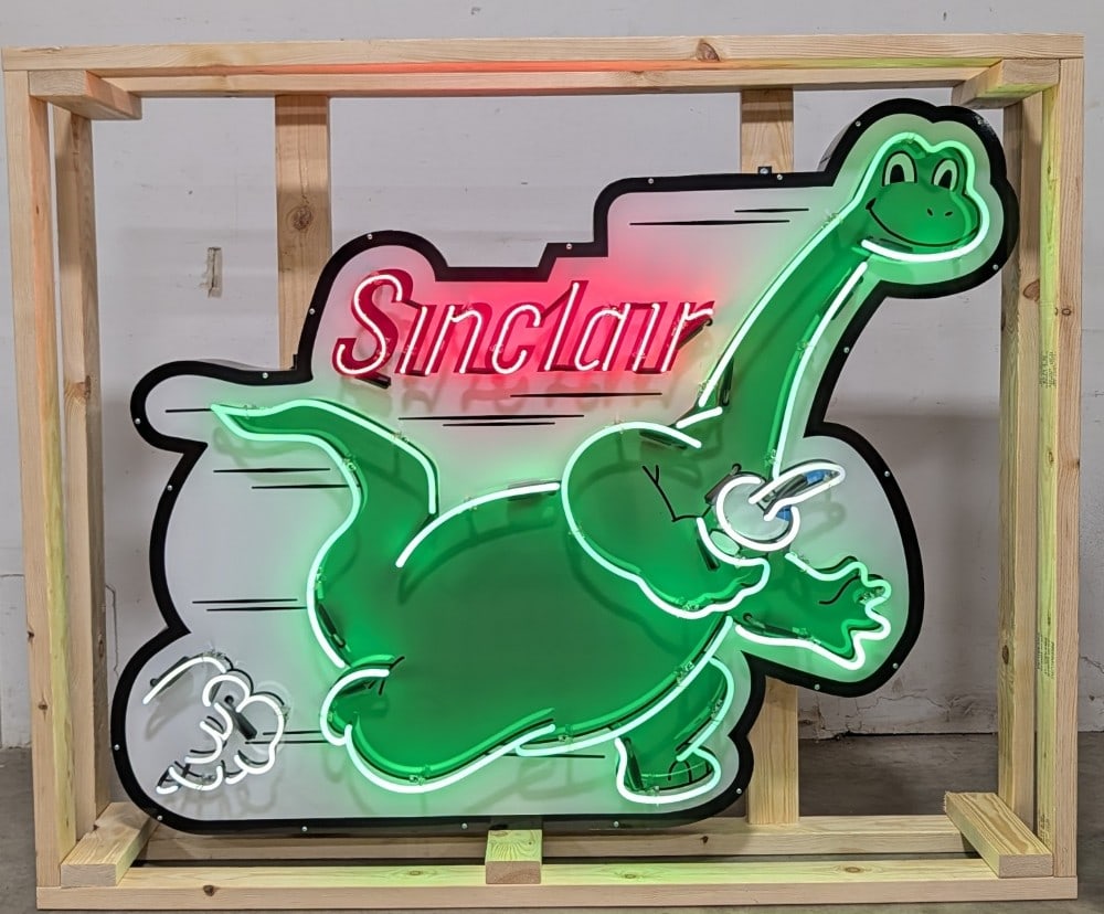 5ft Custom Sinclair Neon Sign: Single sided tin custom Sinclair neon advertising sign. Sign features high gloss shine, new neon glass,and transformers. Easily displayed with die cut can featuring hanging brackets. Has been nicely