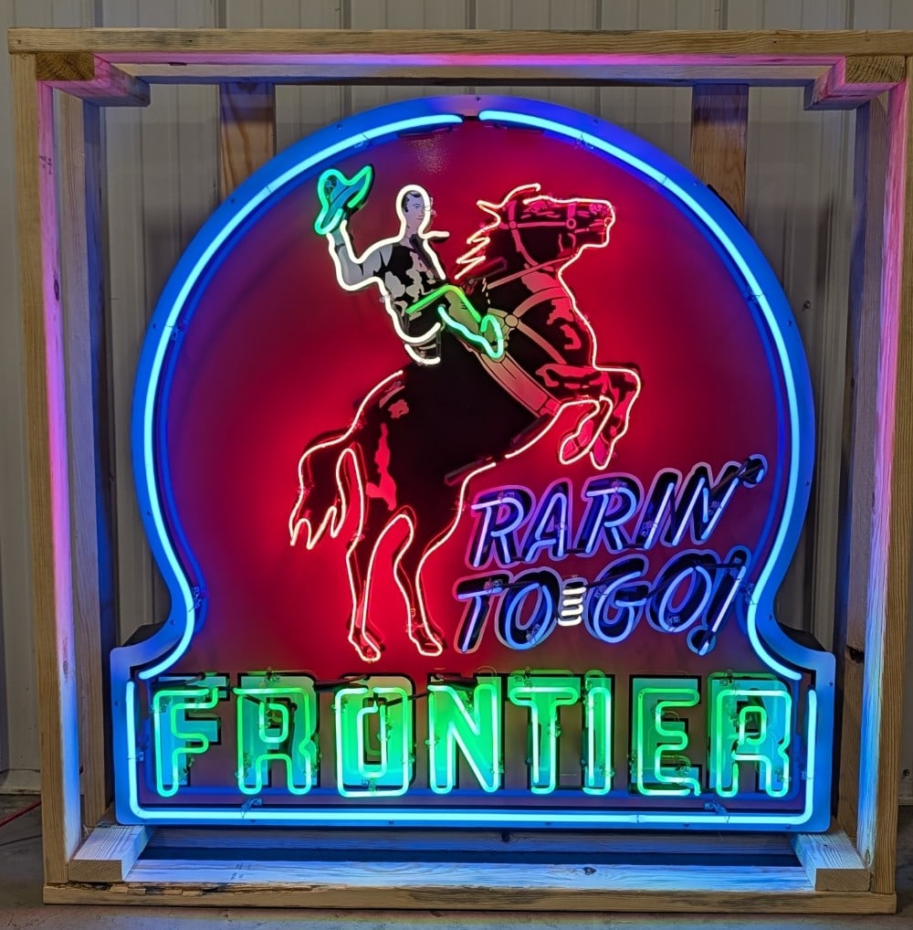 4ft Custom Frontier Key Hole Tin Neon Sign: Single sided tin custom Frontier Gas neon advertising sign. Sign features high gloss shine, new neon glass,and transformers. Easily displayed with die cut can featuring hanging brackets. Has been nice