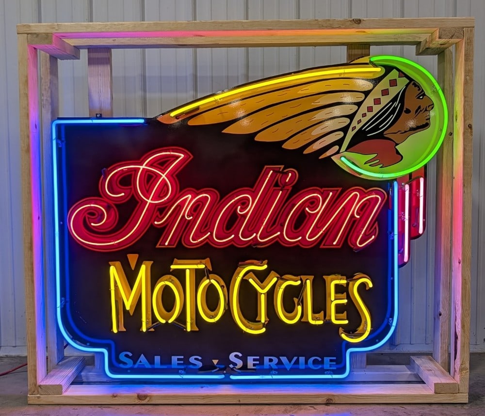 5ft Custom Indian Moto Cycles Neon Sign: Single sided tin custom Indian Motorcycles neon advertising sign. Sign features high gloss shine, new neon glass,and transformers. Easily displayed with die cut can featuring hanging brackets. Has bee