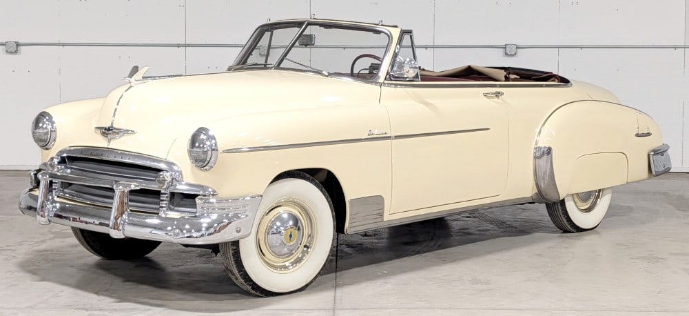 1950 Chevrolet Deluxe Convertible: Sells with no reserve! Finished in Moonlight Cream over a contrasting red and beige interior Black convertible top with maroon welting 235 cu. in inline-six-cylinder engine; 3-speed manual
