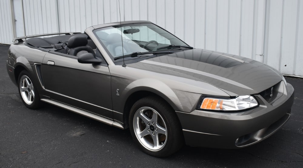 2001 Ford Mustang Cobra Convertible: 72,000 miles 320HP DOHC 4.6L V8 5-speed manual transmission Power convertible top Power steering Power 4-wheel disc brakes Aftermarket Kenwood stereo Power seats Power door locks Remote keyless entry