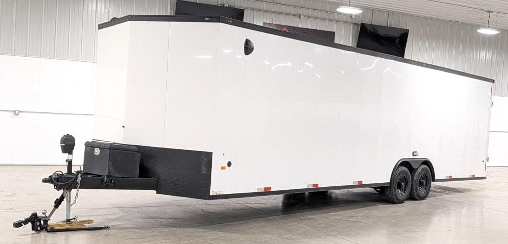 2023 35' Haul-About Enclosed Trailer: Sells with No Reserve! Tandem Axle Built in cabinets Finished floor Electric jack V-Nose 2-5/16" Ball Overall Measures 35' Length x 100" Width x 9' Height TITLE IN TRANSIT DELAY (IN) REDUCED ONLINE BU