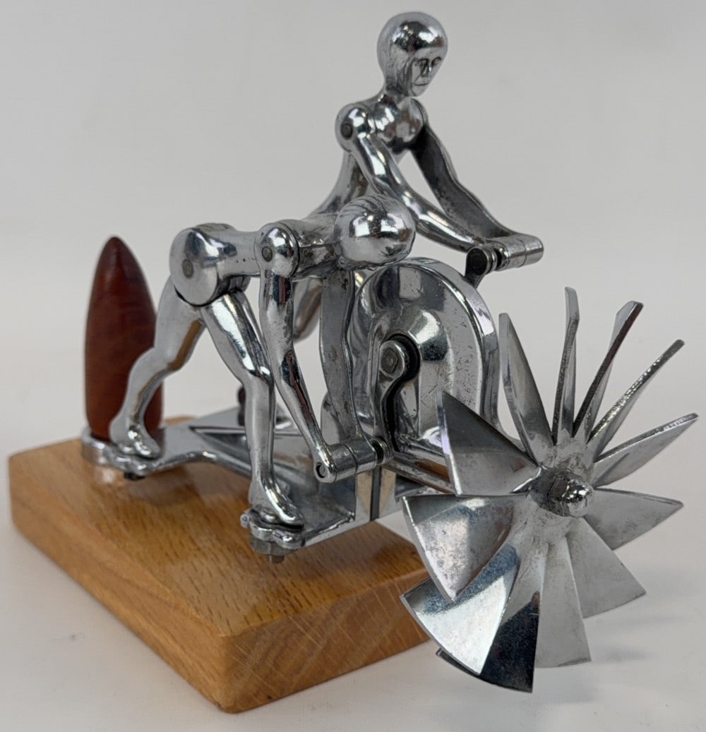 Liberty Action Twins Mechanical Hood Mascot: Marked Action Ornament Co on base. Action is fully functioning. Measures 6? tall with base.