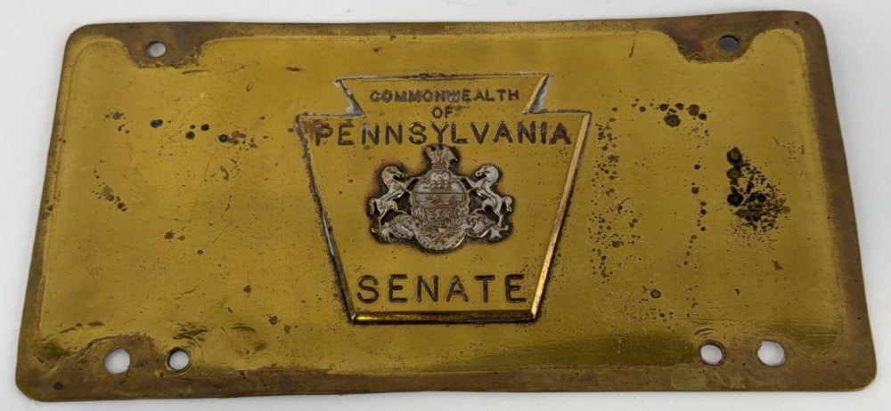 Commonwealth of Pennsylvania Brass ?Senate? License Plate: Unique brass license plate for the senate of the state of Pennsylvania. Has two holes at the top and 4 at the bottom. In our research we could not find another like it, and perfect for any license