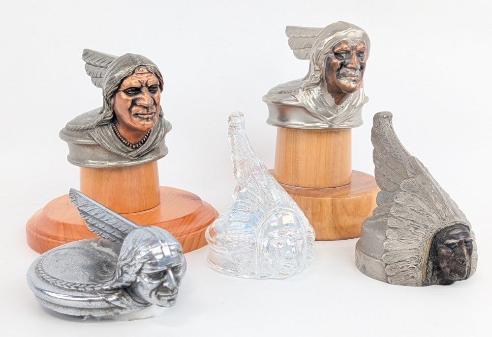 Lot Of 5 Pontiac Indian Head Hood Ornament Radiator Cap Mascots: Lot of five Pontiac Indian Head radiator cap hood ornament Mascots. Lot includes an original 1931, original 1926, original 1928, reproduction 1928, and art glass 1931. They vary in condition. Some do