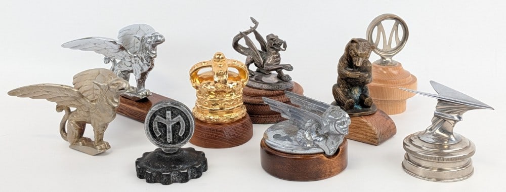 Group Of 9 Hood Ornament Radiator Cap Mascot: Unique grouping of nine hood ornament / radiator cap Mascots. Lot includes a Welsh Dragon, Maxwell, 2) Gardner Griffins , an early Mack Truck radiator cap, 1929-1931 Chevrolet Winged Viking, Marmon