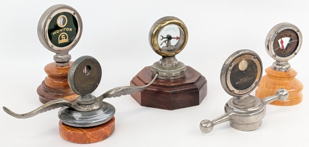 Group Of 5 Temperature Gauge / Semaphore Radiator Cap Hood Ornaments / Moto Meter: Group of five temperature gauge radiator cap hood ornaments. Lot includes a Boyce Moto Meter Junior, Arro-meter Juniors, Monitor, Calormeter, and winged Boyce Moto Meter. They vary in age and conditio