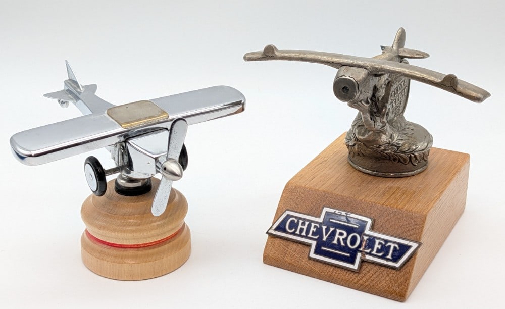 (2) Airplane Mascots: Includes Chevrolet "Spirit Of St. Louis" Quota Trophy Car Mascot & Airplane.?6" Tallest including wooden base.