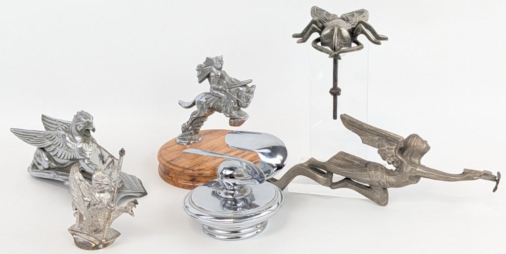 Lot of 6 Automobile Mascot Hood Ornaments: This lot includes a 1930s Hudson Essex Griffin Mascot, a 1920s Vauxhall Griffin Mascot, a Flying Goddess with airplane, and more. Largest ornament is approximately 9-1/2" in length.