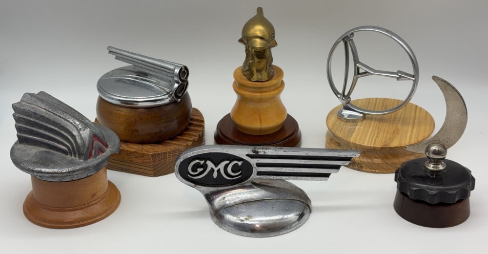 Lot of 6 Original Collectible Radiator Cap Hood Mascots: This lot features a Moon Motor Car Company Crescent Moon mascot, a Double Chevron for 1957 UK Citroen, an Austro-Daimler encircled bow & arrow mascot, an original 1936 GMC truck radiator cap, an origi
