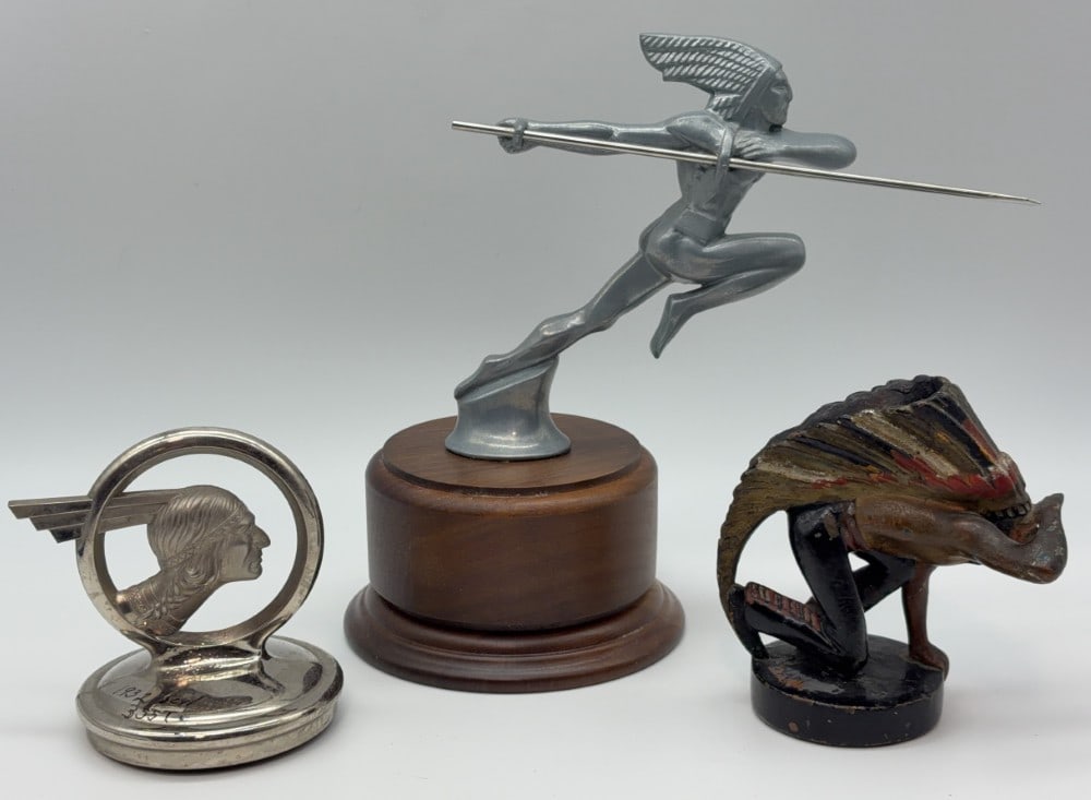 Lot of 3 Native American Radiator Cap Hood Mascots: Lot includes a painted Guillaume Laplagne Native American crouching scout, 1930s Pontiac "Chief in a Circle", and F. Bazin's Native American Indian with javelin on wooden base. Tallest is approximatel