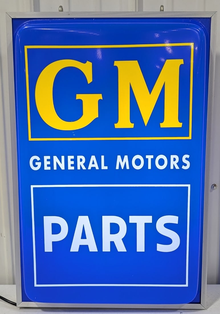 Custom GM General Motors 2-Sided Lighted Sign: Custom made GM General Motors double sided lighted plastic advertising sign. Nice working condition with some scratches and wear form display and storage. It measures approximately 24in tall by 16in a