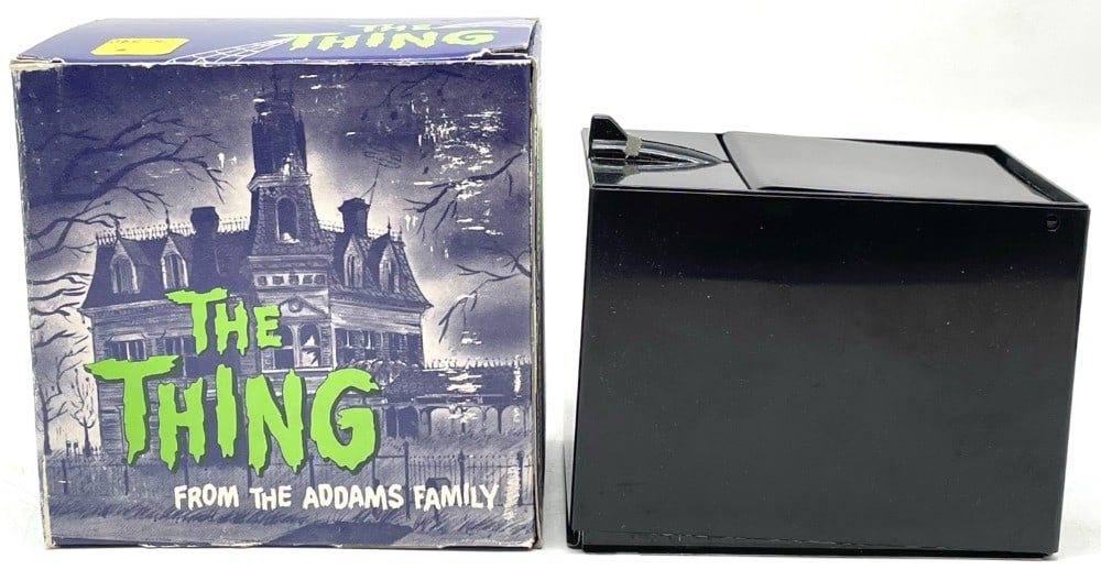 1964 The Thing From The Addams Family Bank: 1964 The Thing From The Addams Family Bank. 1964 TV Productions Bank appears to be never used. Box is in overall good condition.