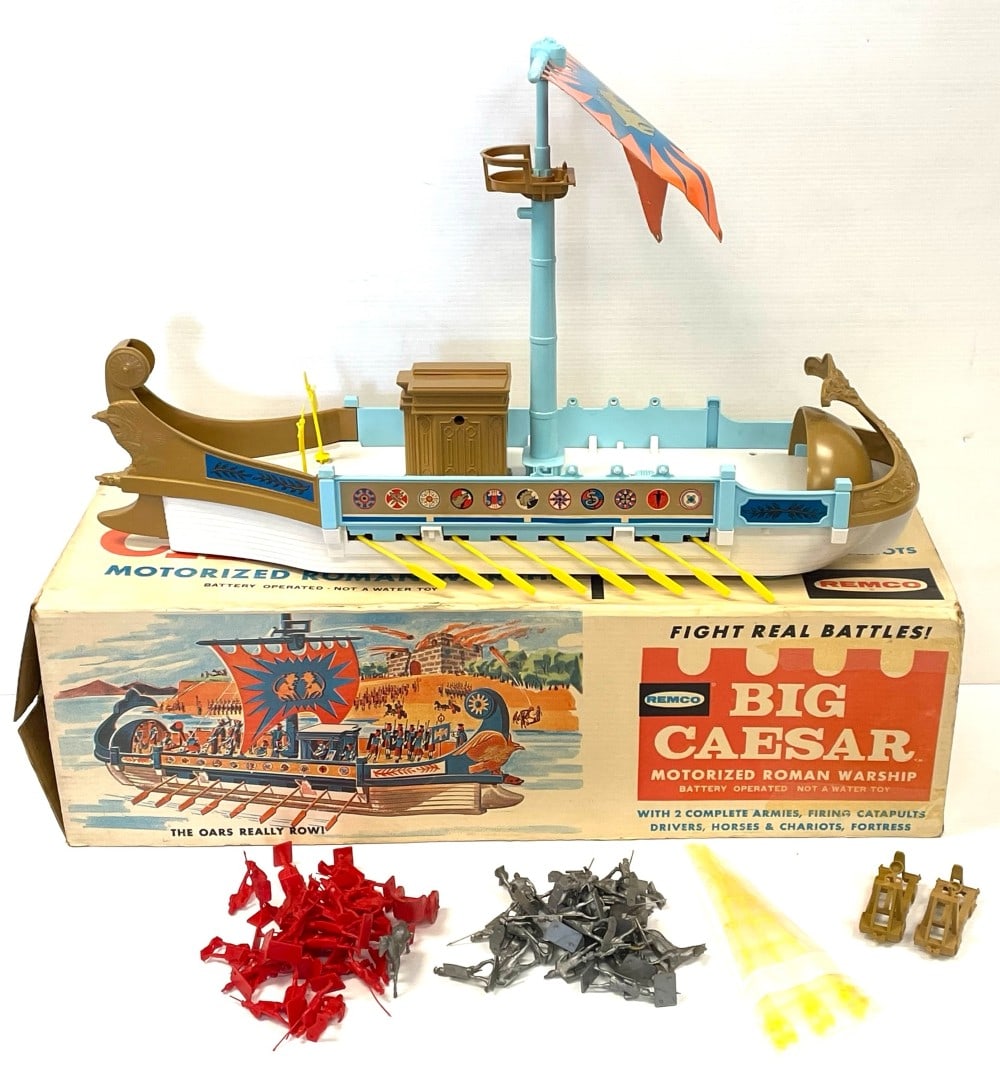 1963 Remco Big Caesar Roman Warship: 1963 Remco Big Caesar Motorized Roman Warship with Red and Gray Figures, 2 Catapults, 2 Flags, and Crows Nest with Original Box. Missing 1 Flag, 2 Cannons, Fortress. Toy is in overall good condition a
