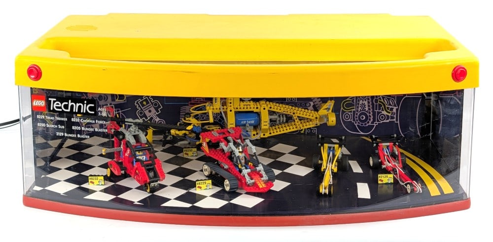 Lego Technic Lighted Store Display: Lego Technic lighted store display. Includes set #8229 Tread Tekker, #8232 Chopper Force, #8250 Search Sub, #8205 Bungee Blaser, and #2129 Bungee Blaster. The store display lights up and makes noise w