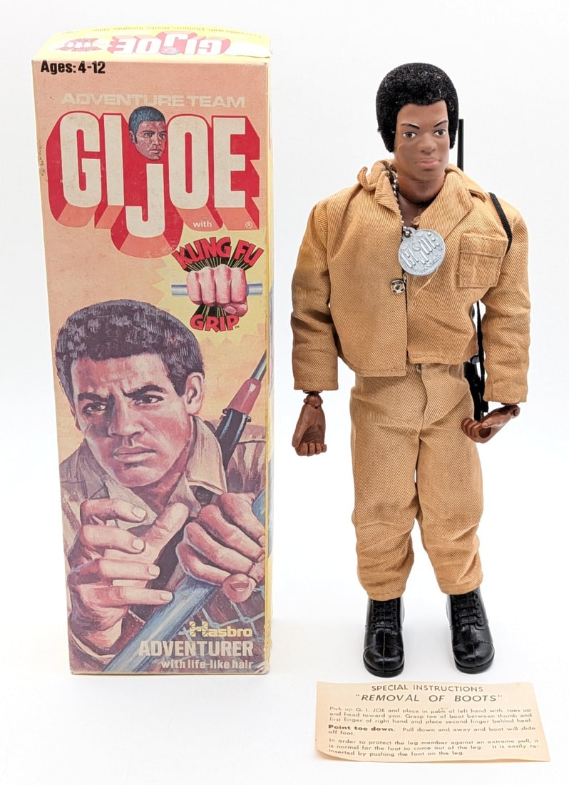 Vintage Hasbro GI Joe African American Adventurer Figure #7283 w/ Box: Vintage Hasbro GI Joe African American Adventurer figure #7283 with the box. The figure comes with the uniform, boots, dog tag, rifle, and boot removal instructions. The figure has life like hair and
