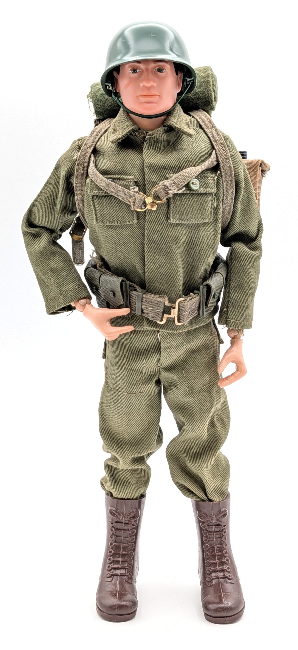 Vintage Hasbro GI Joe with Combat Equipment: Vintage Hasbro GI Joe with combat equipment. The figure comes with helmet, pack, outfit, boots, and more. The figure has the usual stress cracks and play wear.