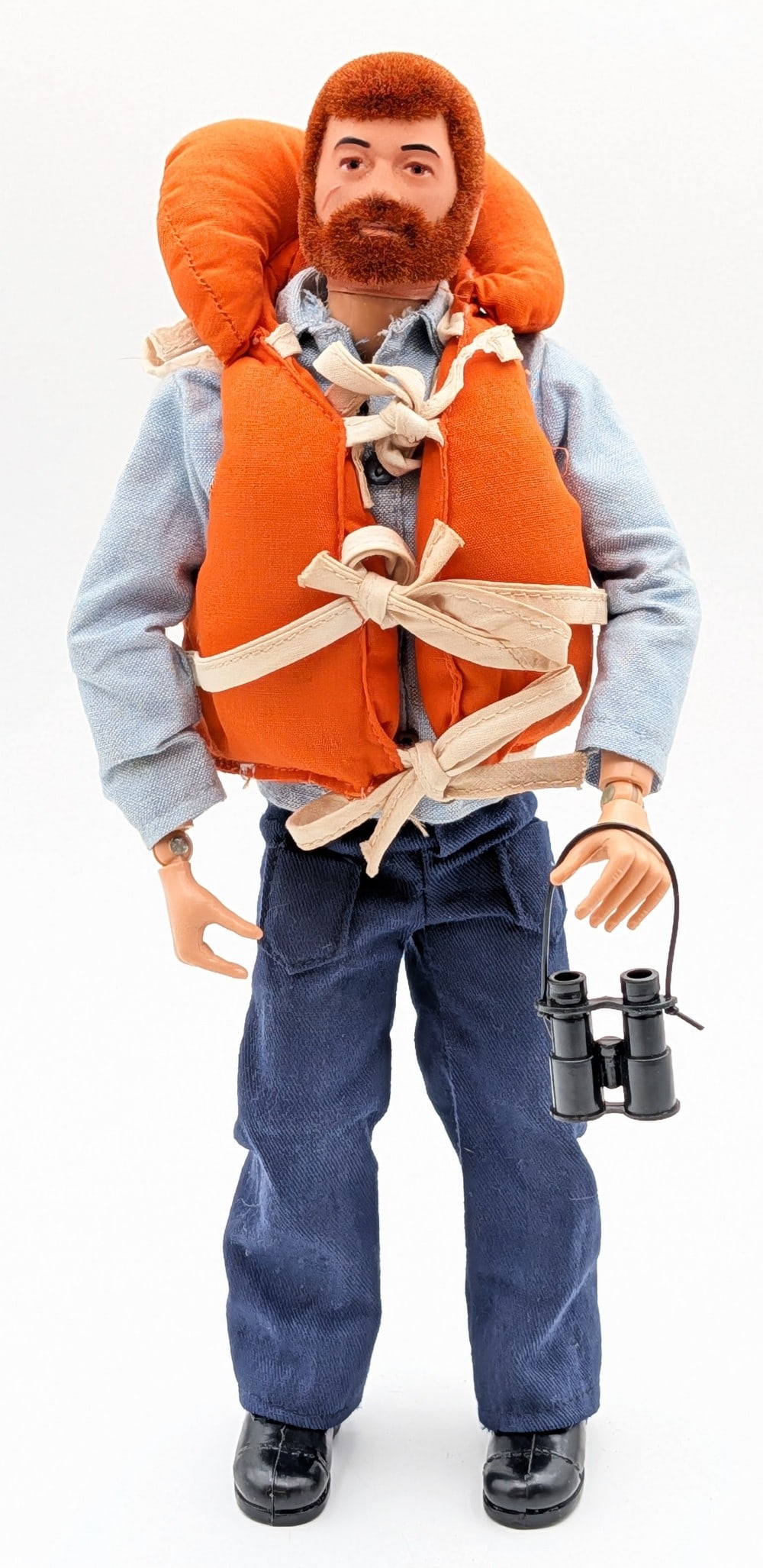 Vintage Hasbro GI Joe Action Sailor Figure: Vintage Hasbro GI Joe action sailor figure. The figure comes with life jacket, binoculars, and outfit. The figure has flocked life like hair. It shows the usual stress cracks and light play wear.?