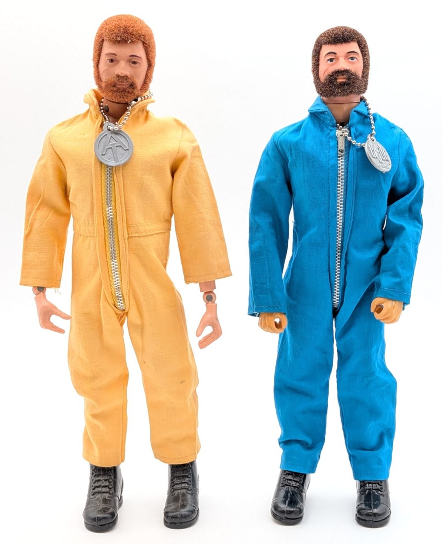 (2) Vintage Hasbro GI Joe Figures w/ Blue and Yellow Jumpsuits: (2) Vintage Hasbro GI Joe figures. The figures come with a yellow and blue jumpsuit. Both have the boots and dog tags. They both have flocked lifelike hair. The kung fu grips hands appear to be