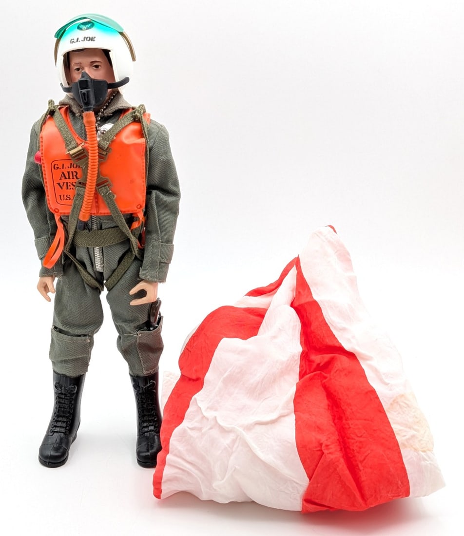 Vintage Hasbro GI Joe Air Force Pilot Figure: Vintage Hasbro GI Joe action soldier Air Force Pilot figure. The figures comes with helmet, air vest, pack, and parachute. The figure shows the usual stress cracks and light wear from play / age.