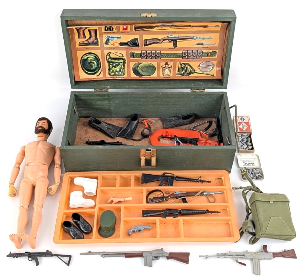 Vintage Hasbro GI Joe Figure w/ Footlocker & Accessories: Vintage Hasbro GI Joe figure with footlocker and accessories. The figure has flocked hair and comes with rifles, shoes, and other accessories. The lid of the footlocker has damage. The figure and acce