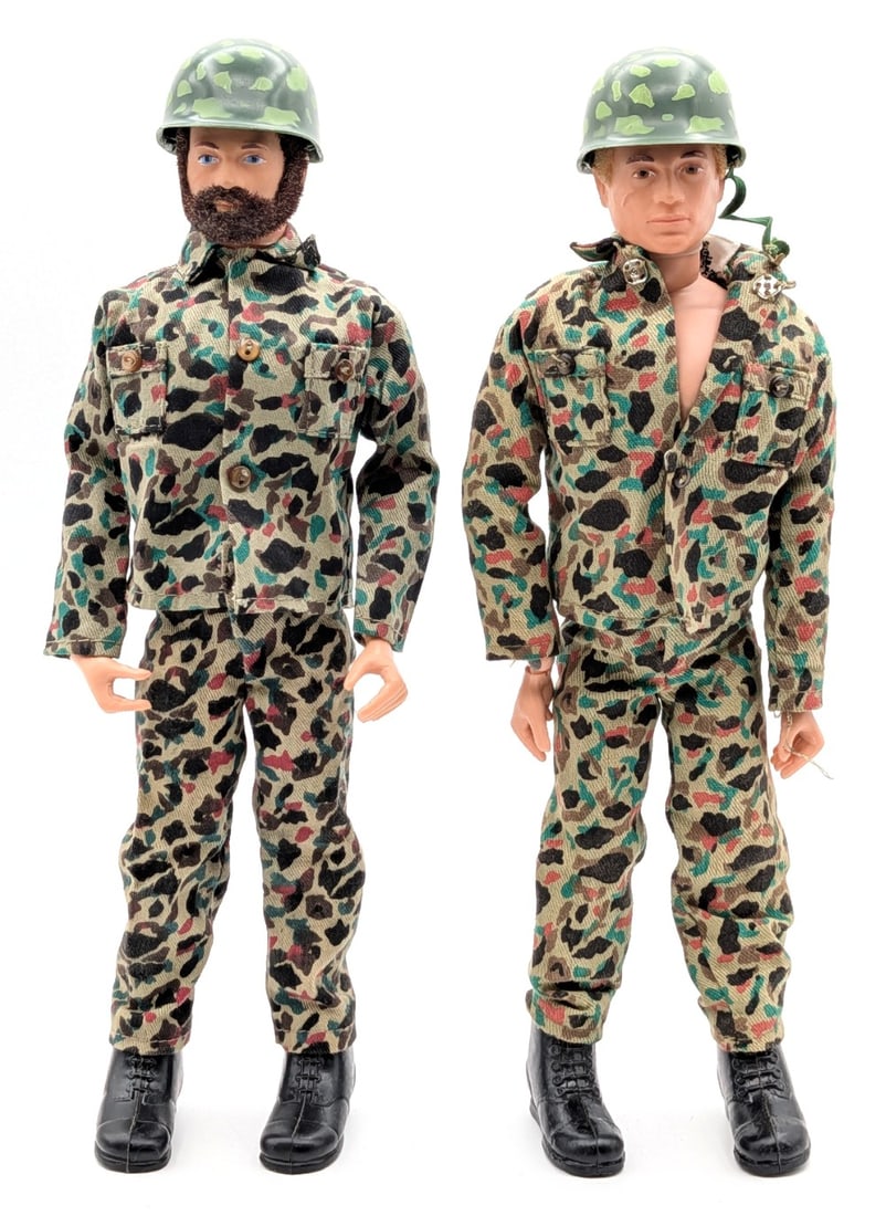 (2) Vintage Hasbro Action Marine Figures w/ Camouflage Outfits: (2) Vintage Hasbro action soldier figures with camouflage outfits. The soldiers have blonde and brown flocked hair. They have the usual stress cracks and wear from play and age.