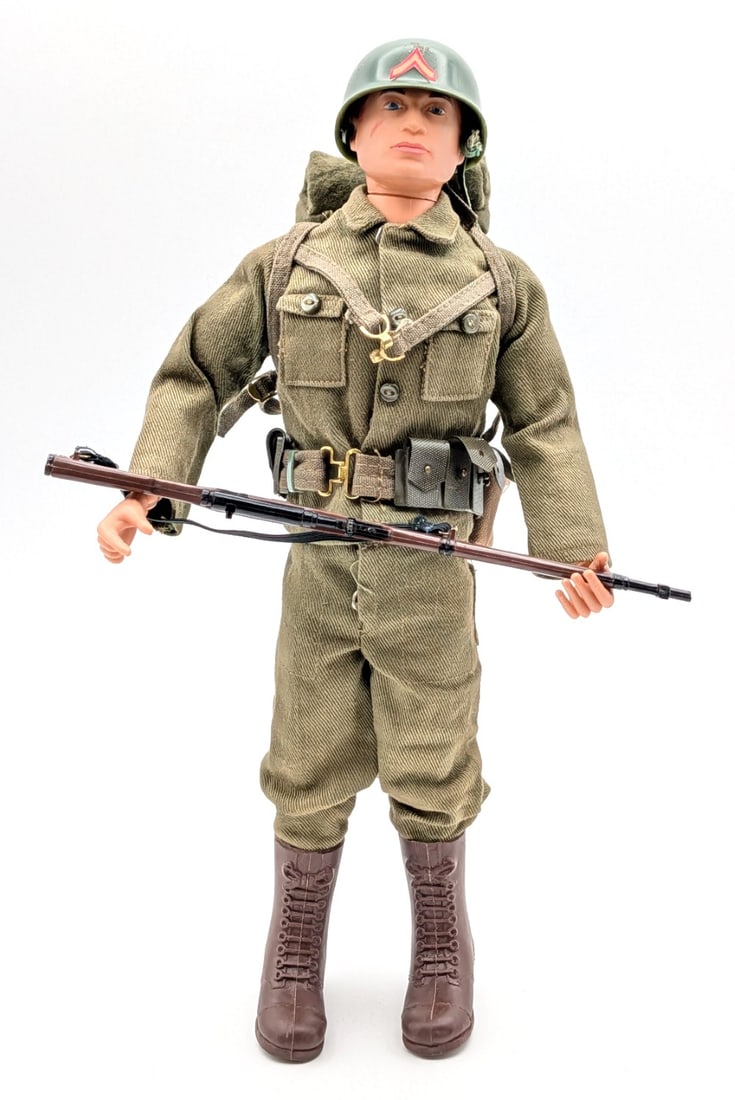 Vintage Hasbro GI Joe Action Soldier Figure: Vintage Hasbro GI Joe action solder figure with outfit. The figure includes helmet, rifle, pack, belt, boots, and outfit. The figure has the usual stress cracks and wear from play and age.