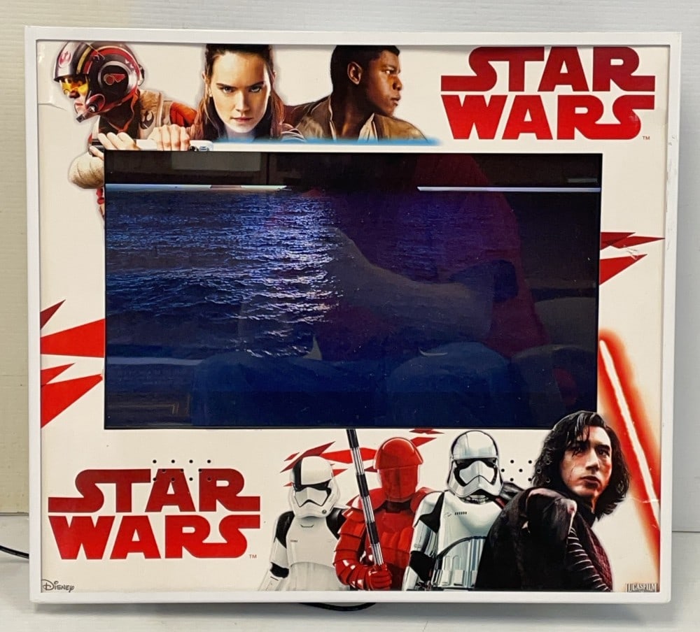 Star Wars Disney Toys R Us Display: Star Wars Disney Toys R Us Display. Display Works and is Programmed with Movie Trailer and Vintage Star Wars Commercial. Display Measures 21? x 19? has small crack on top left.