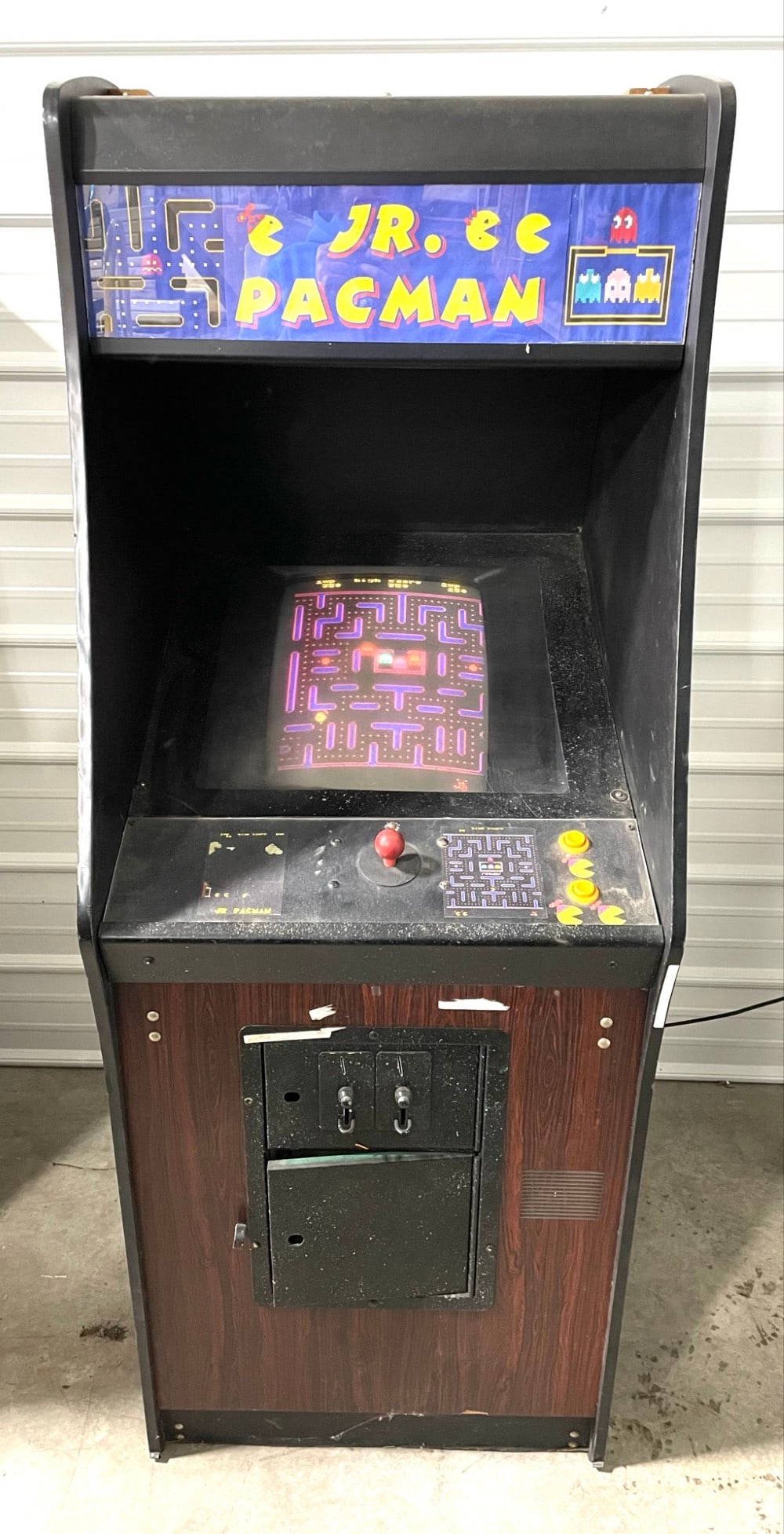 Vintage Jr. Pac-Man Arcade Machine: Vintage Jr. Pac-Man Arcade Machine Cabinet. Cabinet has some Scratches and It Works but might need rewiring(Small Short). Measures 25? x 32? x 68