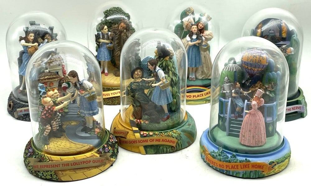 7 Wizard of Oz Turner Entertainment Limited Edition Domed Music Boxes: The music boxes are all in very good working condition with no chips or breaks. You will recieve the following music boxes: "There's No Place Like Home" WRS 9625, "We Represent the Lollypop Guild"