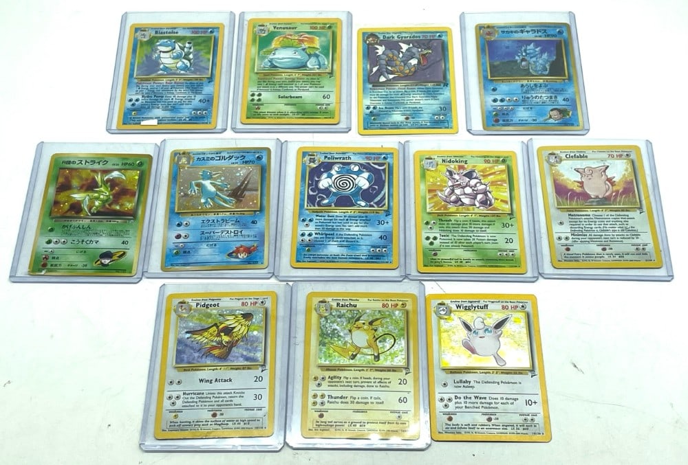 (12) Pokemon Holo Trading Cards: (12) Pokemon Holo Trading Cards. Trading Cards are from Base Set 2, Japanese Gym 2 Set, and Dark Gyarados. Cards are in Varying Condition with Edgeware and no Penny Sleeves.