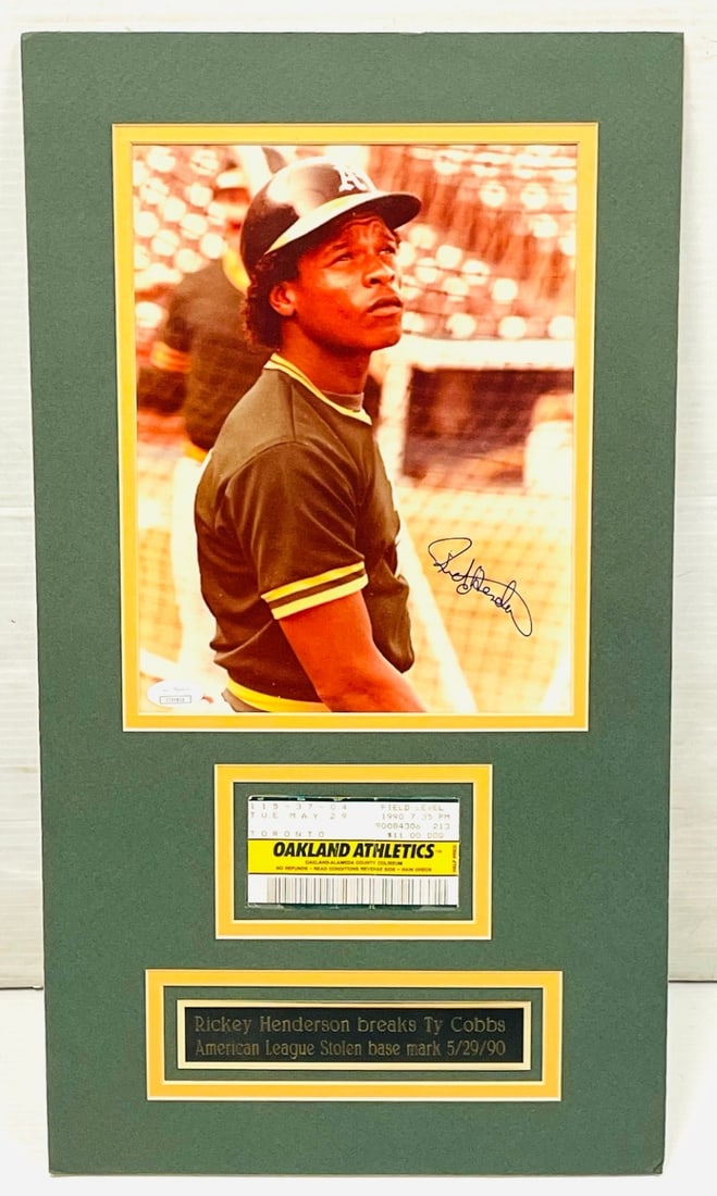 Rickey Henderson Signed Photo and Ticket Stub: Rickey Henderson Signed Photo and Ticket Stub. Ticket Stub is when he broke Ty Cobb Stolen Base Record. JSA Authenticated and Measures 11? x 20