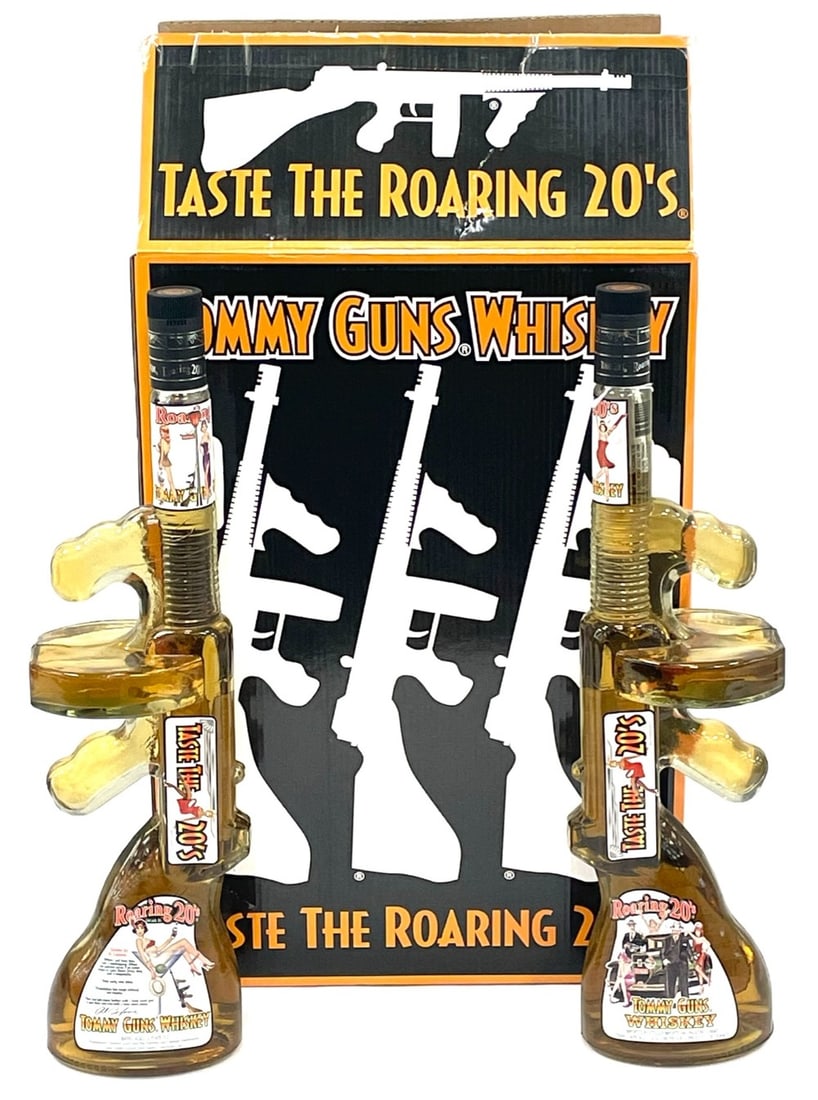 Pair of Sealed Roaring 20's Tommy Guns Whiskey 80 Proof 750ml with Box: Pair of Sealed Roaring 20's Tommy Guns Whiskey 80 Proof 750ml With Box. These glass gun shaped bottles are factory sealed and in great condition. It was barrel aged and marked 2 years old when it was