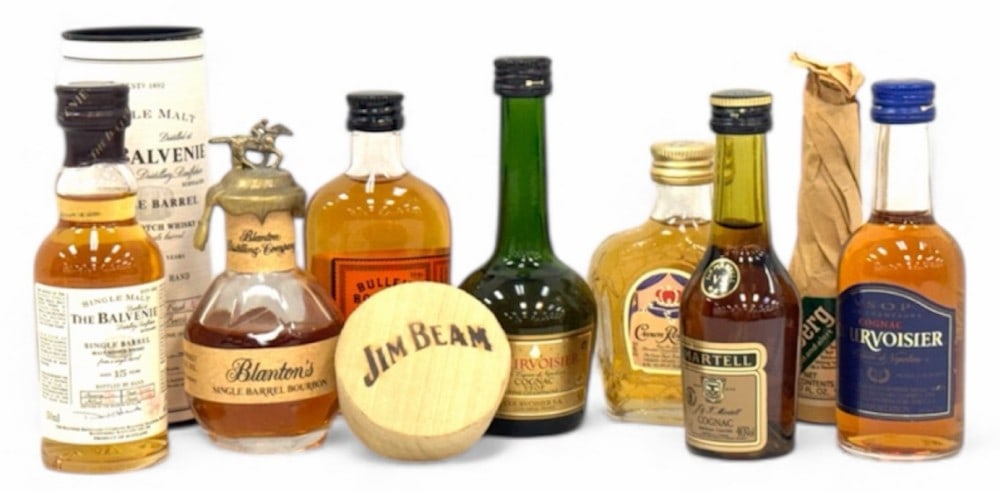 Assortment of Sealed Liquor Bottles Including Whiskey, Cognac, Bitters, & More: Assortment of Sealed Liquor Bottles Including Whiskey, Cognac, Bitters, & More. Included is a 50ml Single Malt The Balvenie single barrel whisky aged 15 years, still sealed and in great condition, a 5
