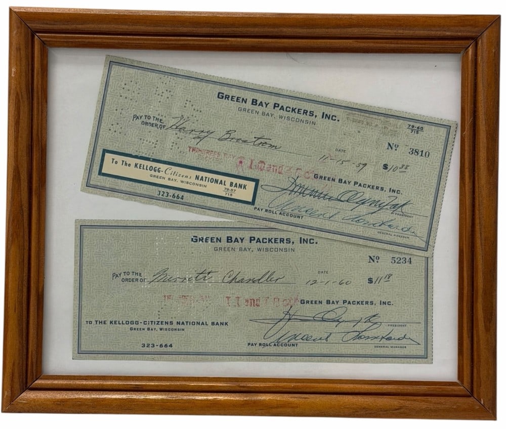 Framed Green Bay Packers Checks Autographed By Vincent Lombardi: Framed Green Bay Packers Checks Autographed By Vincent Lombardi. Included are two Green Bay Packers checks both signed by former coach Vince Lombardi. (No COA). One check is made out to Harry Brostrum
