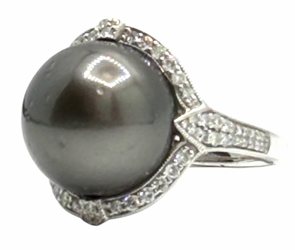 Platinum 0.51ctw South Sea Pearl and Diamond Ring: Platinum 0.51ctw South Sea Pearl And Diamond Ring. A near round cultured south sea pearl is mounted in the center of the ring. 72 round brilliant cut diamonds, weighing approximately 0.51 carats, acce