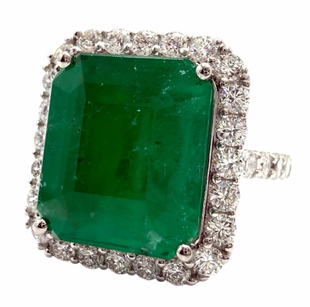 Platinum 7.05ctw Brazilian Emerald and Diamond Ring: Platinum 7.05ctw Brazilian Emerald And Diamond Ring. One polished, stamped, and tested platinum ring marked Oscar Friedman. The ring is mounted with: 1 genuine GIA certificate emerald center stone wei