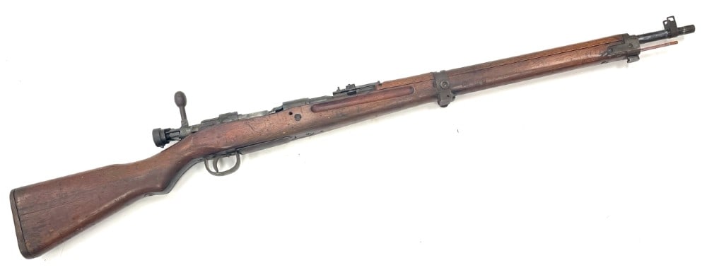 WW II Japanese Type 99 7.7x58 Bolt Action Rifle with Mum: WW II Japanese Type 99 7.7x58 Bolt Action Rifle with Mum.? The WW II Japanese type 99 bolt action rifle is in used condition.? Barrel measures 25 inches in length.? Rifle obtains the full mum.? Wood s