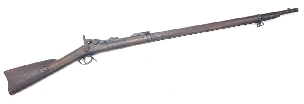 US Springfield Trapdoor Model of 1873 45-70 Caliber Percussion Rifle: US Springfield Trapdoor Model of 1873 45-70 Caliber Percussion Rifle.? The US Springfield Trapdoor model of 1873 rifle is in nice used original condition.? Barrel measures 36 inches in length.? Barrel