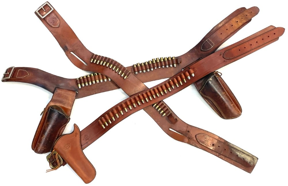 Trio of old Western Gun Belts with 68 Reloaded 45 & 38 Caliber Ammo: Trio of old Western Gun Belts with 68 Reloaded 45 & 38 Caliber Ammo.? The perfect lot for your hunting lodge or mancave.? Three Western style gun belts with reloaded ammo.? Gun belts are in nice used