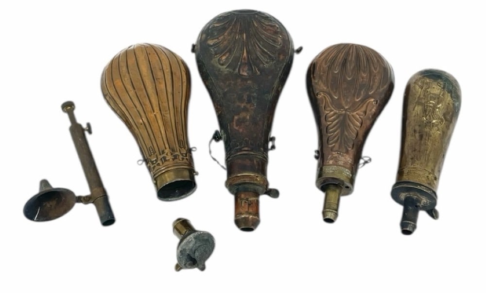 Collection of Cooper & Brass Gun Powder Flasks: Collection of Cooper & Brass Gun Powder Flasks .? The four cooper / brass gun powder flasks are in used condition.? Very nice designs and the smallest one obtains a picture of a Civil War soldier with