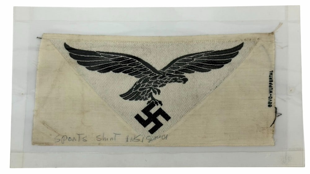 WWII German Luftwaffe Sport Shirt Eagle: WWII German Luftwaffe Sport Shirt Eagle. The WWII German Luftwaffe sport shirt eagle is in nice used condition. The eagle has been in a sealed plastic to preserve its nice aged condition.? The cloth m