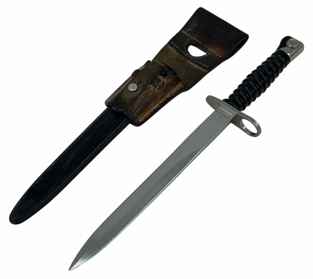 Swiss M57 Bayonet with Sheath & leather Frog: Swiss M57 Bayonet with Sheath & leather Frog.? The Swiss M57 Bayonet with frog & sheath are in nice used condition.? Blade measures 9.5 inches in length.? Blade has the proper wear marks from sheath.?