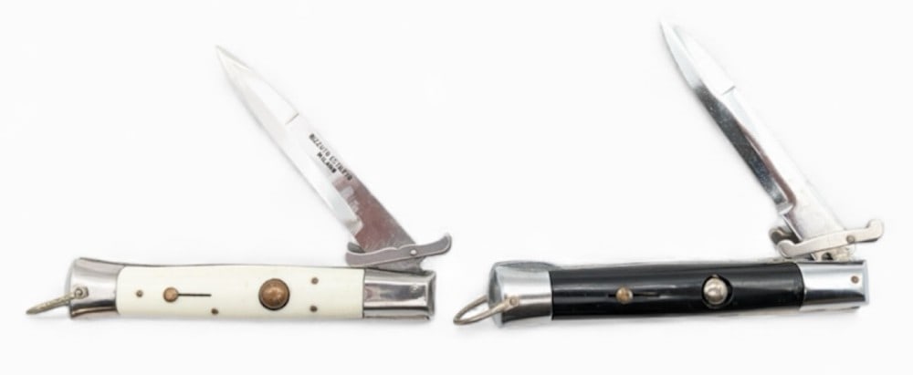 Set of Vintage Itallian Swing Guard Stiletto Switchblade Knives: Knives are in fair condition with scratches on the blades, scuffs and wear on the bolsters, and scuffs and wear on the handle scales. Both knives have good spring. Overall measures 4-3/4in when closed