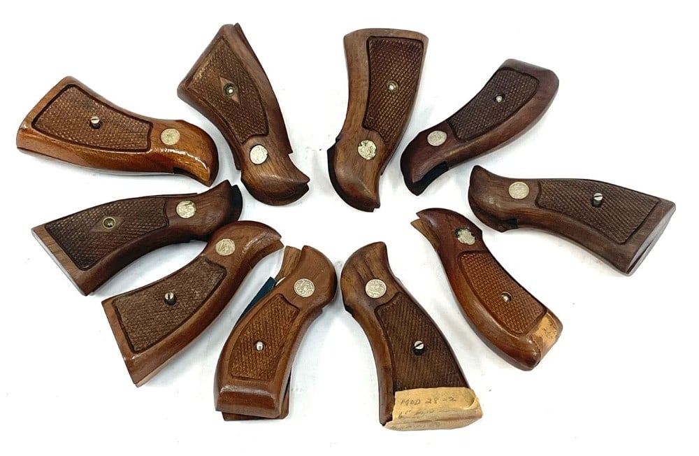 Group of Vintage Smith & Wesson K-Frame Wooden Grips: Group of Vintage Smith & Wesson K-Frame Wooden Grips.? Lot contains 10 vintage Smith & Wesson Revolver K-Frame wooden Grips.? 9 of them contain the screw.? The wooden grips are in nice used condition.