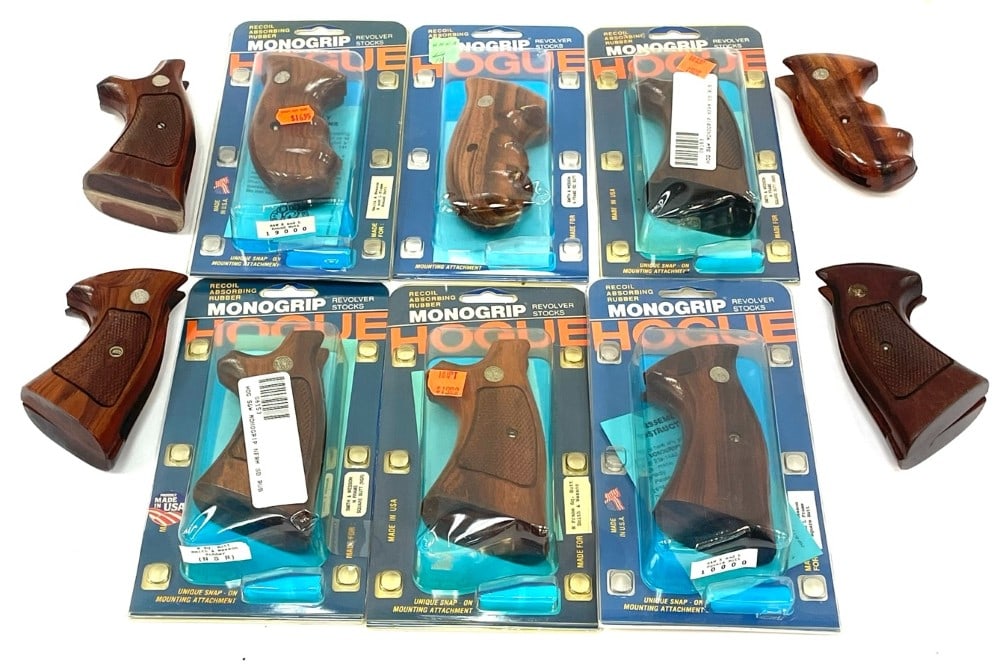 Smith & Wesson Wooden Hogue Grip Collection.: Smith & Wesson Wooden Hogue Grip Collection.? This collection contains 6 NOS Smith & Wesson Hogue grips in the package.? Grips fit a large K, L, and N Frame revolver. 4 other Smith & Wesson wooden gri