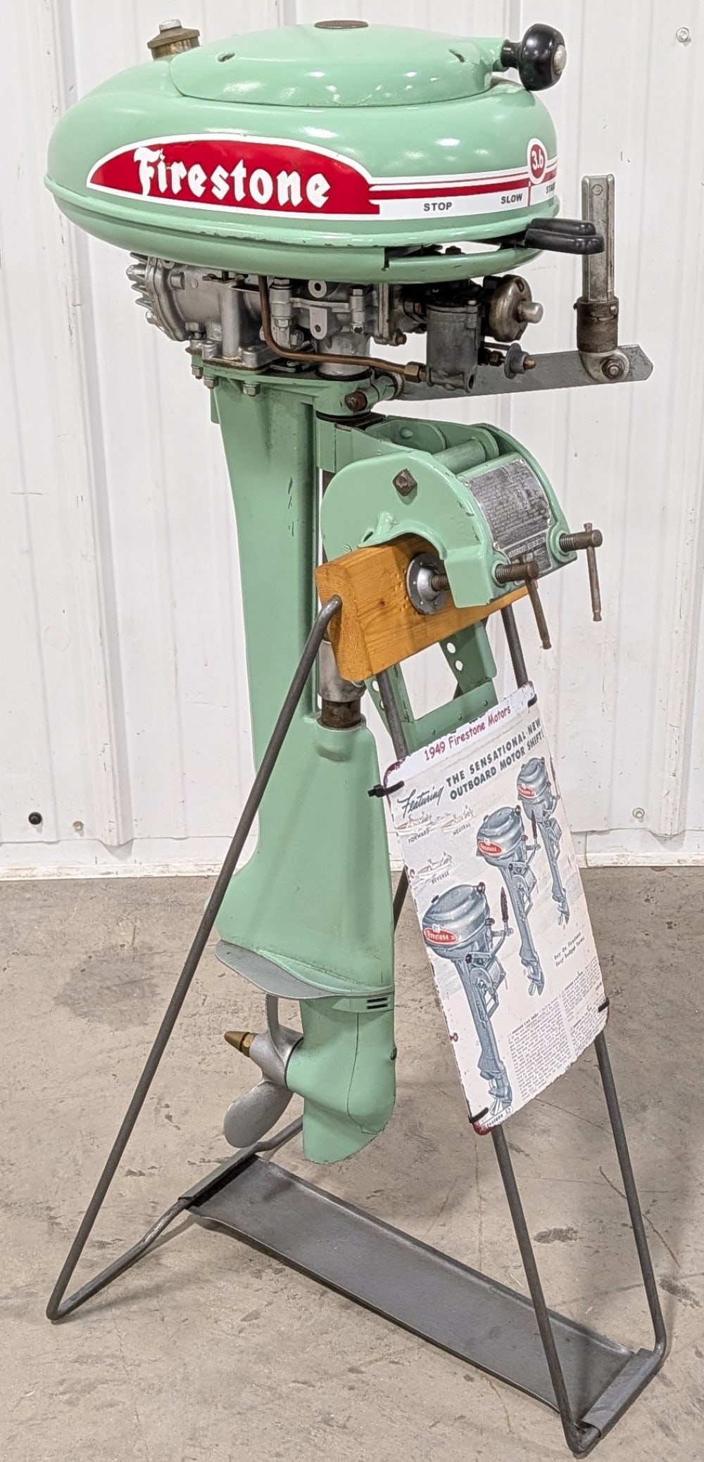 Restored Vintage Firestone Outboard Boat Motor w/ Stand: Restored vintage Firestone outboard boat motor with custom display stand. Appear sto be in overall good cosmetic condition with an older restoration. It does have some paint loss, repair to decal, and