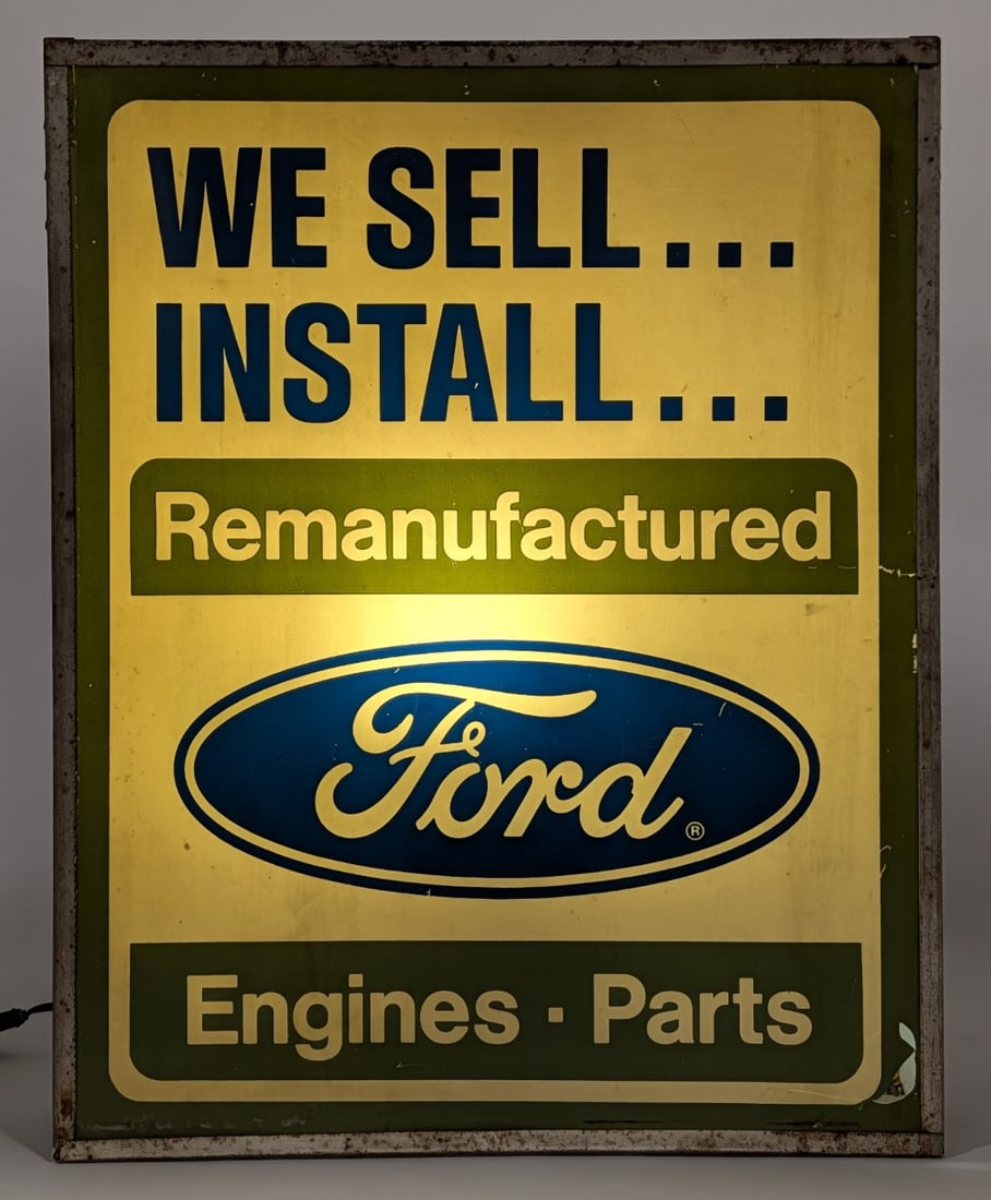 Rare Vintage Ford Engine & Parts Lighted Dealership Advertising Sign: Vintage "We Sell... Install... Remanufactured Ford Engines & Parts" lighted dealership advertising sign. The sign lights up and works as it should. The sign has a plastic face with metal can. The plas