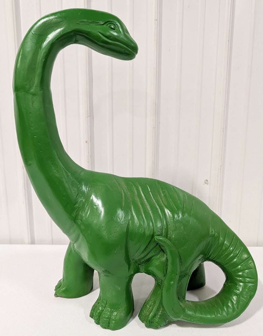 Cast Metal Sinclair Dino The Dinosaur Statue: Cast metal Dino The Sinclair Dinosaur Statue. Ha some paint loss and wear from display and storage. It measures approximately 27in tall by 23in across.